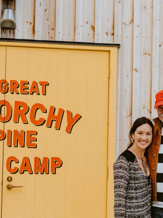 Photo of The Great Glenorchy Base Camp owners, Liz and Doug infront of building