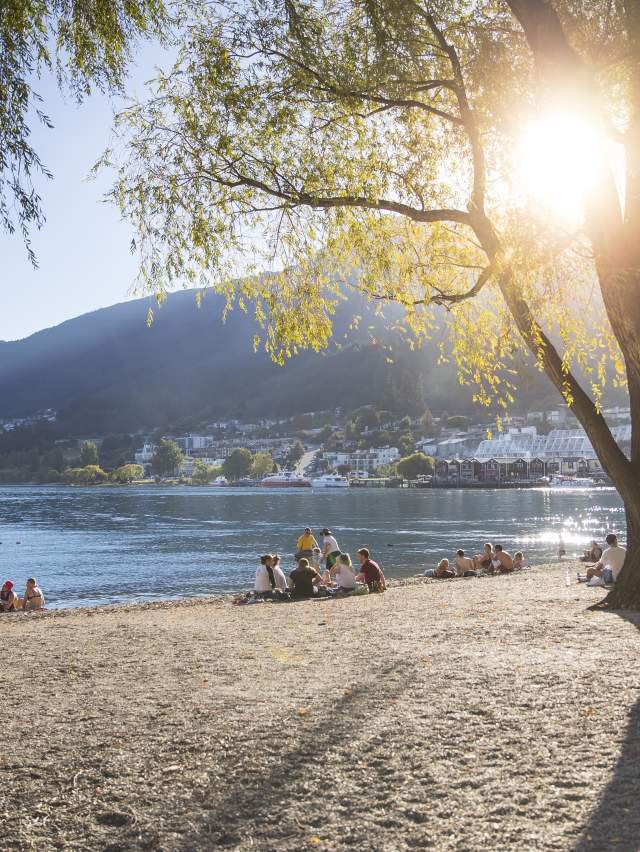 People sitting on Queenstown Bay