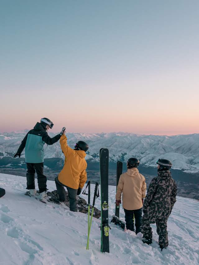 Group of skiers and snowboarders at the top of The Remarkables