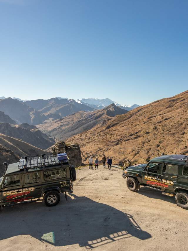 Group with two cars parked at Lighthouse Point on the Skippers Road Queenstown