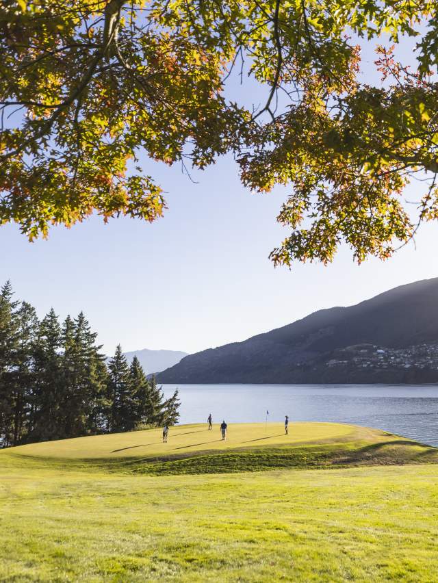 Golfers at Queenstown Golf course in spring