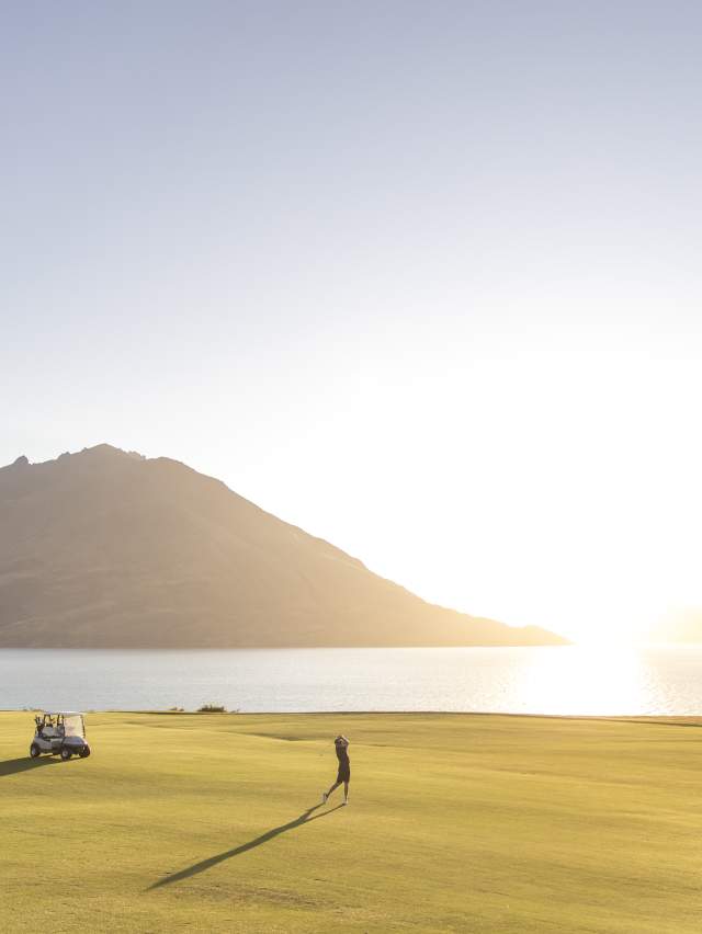 Golfer takes a swing at Jacks Point in summer