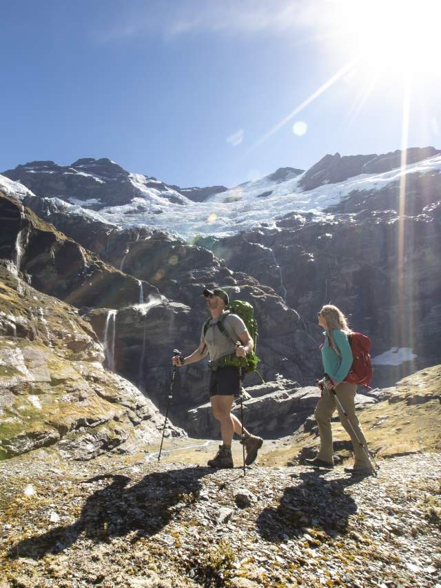 Couple hiking Earnslaw Burn in Summer