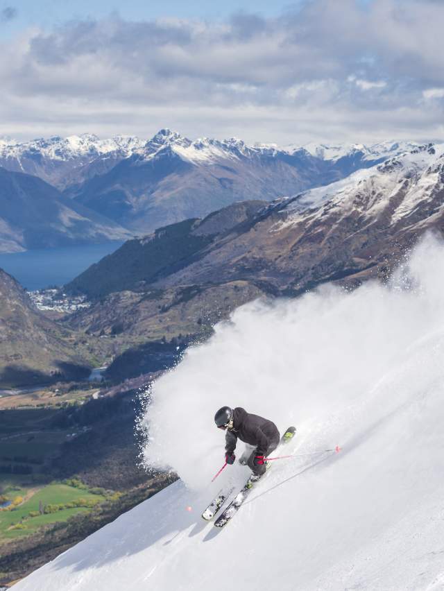 Man Skiing at Coronet Peak with beautiful views over Queenstown