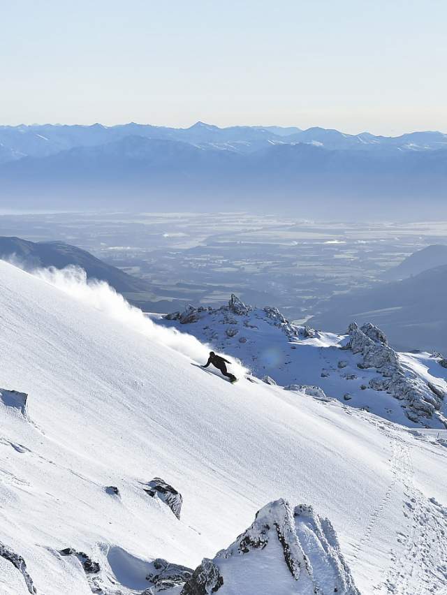 Snowboarder off psite at Cardrona Alpine Resort