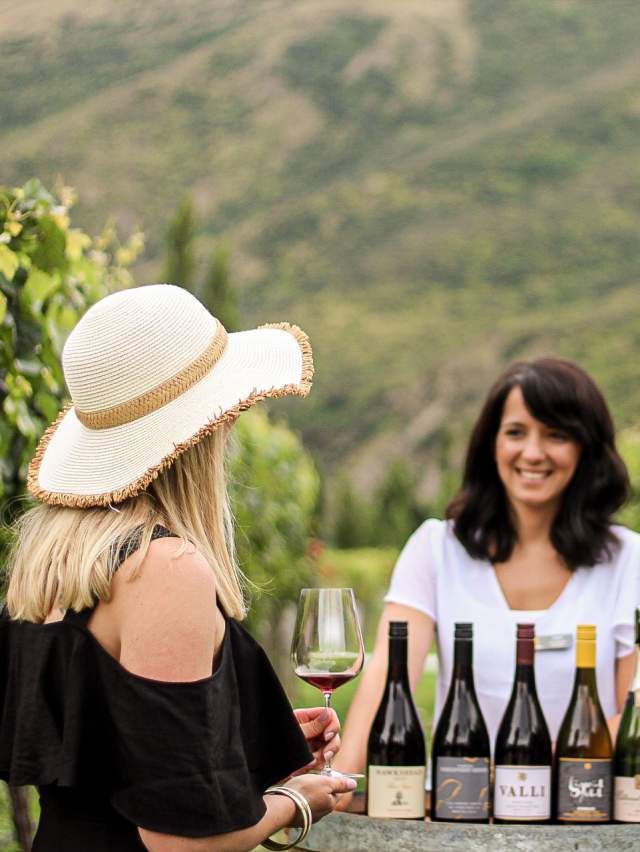 Couple wine tasting at Kinross in the vines with a sommelier