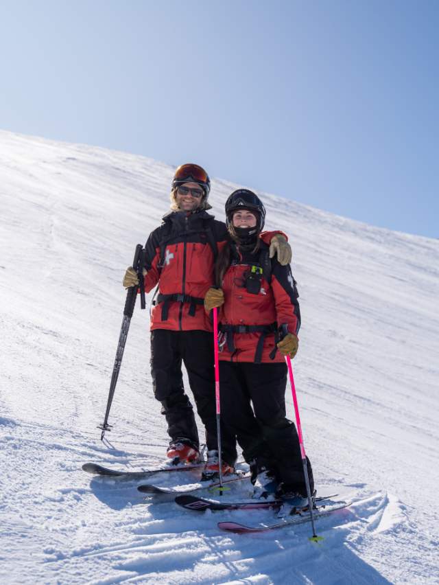 Ski patrollers Charlotte and Sam on the slopes at Coronet Peak