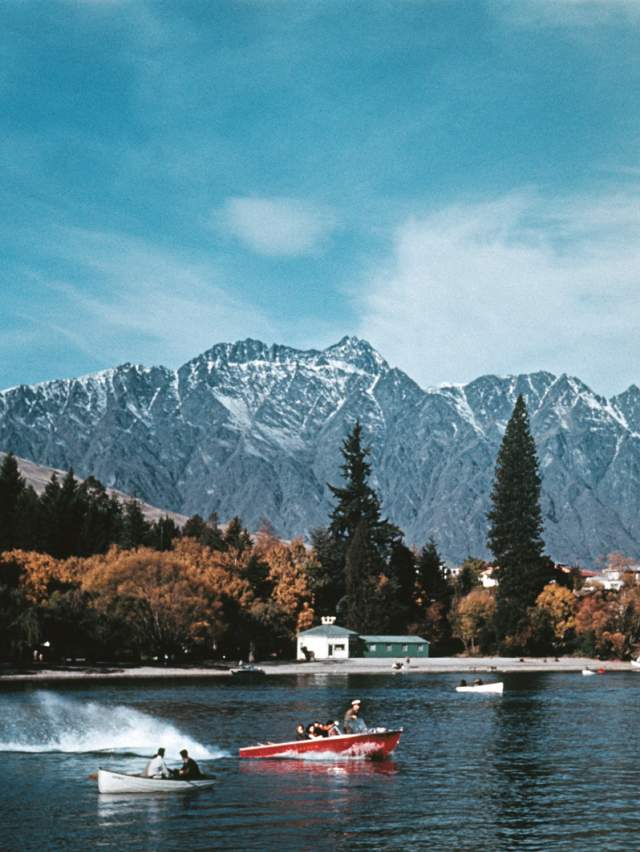 Historical photo of Kawarau Jet on Queenstown Lake with mountains in the background