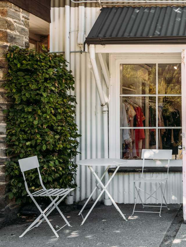 Outside view of a a white, cottage-style looking boutique shop