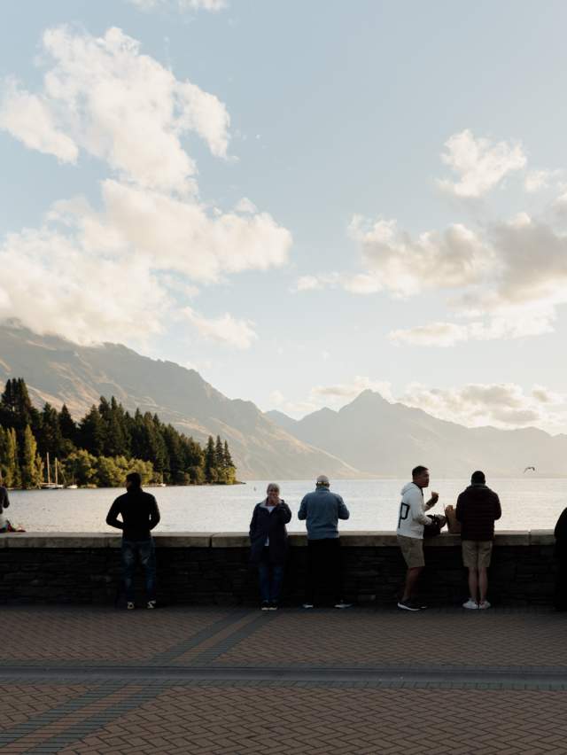Queenstown Bay at dusk with mountains in the background
