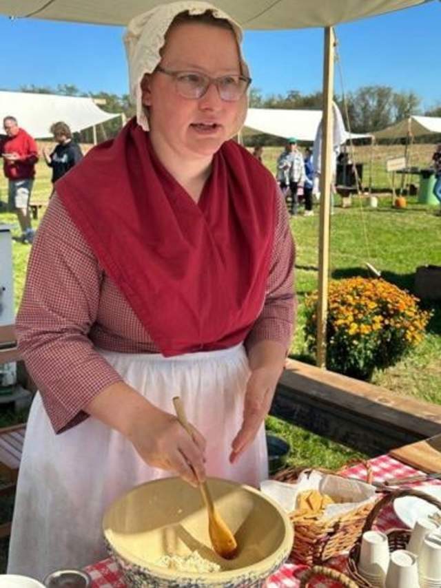 Heidi Eppenbach whips up samples of fresh horseradish on crackers for hungry event attendees.