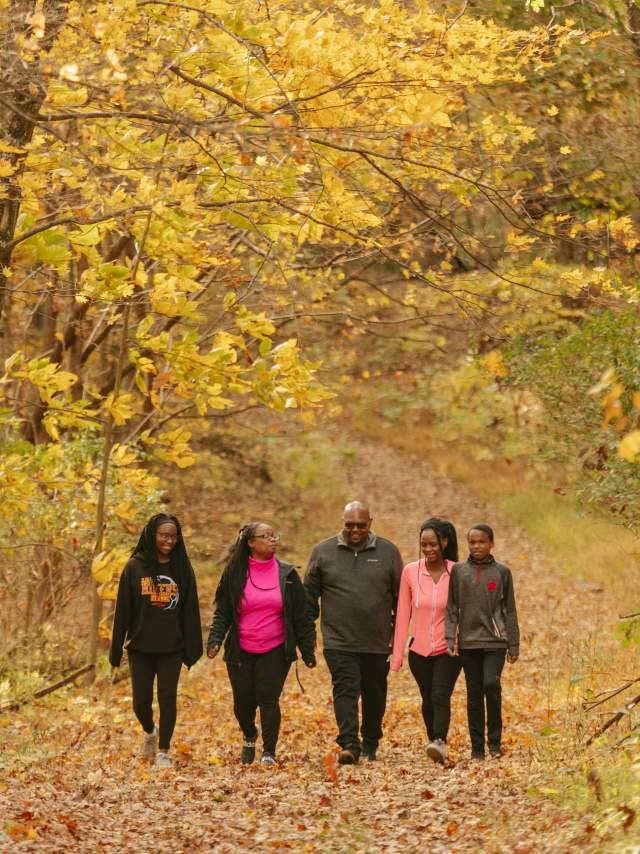 Family of five hiking in the fall.