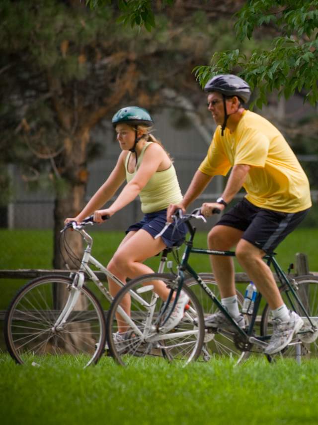 People Riding Bikes Through Omaha Park
