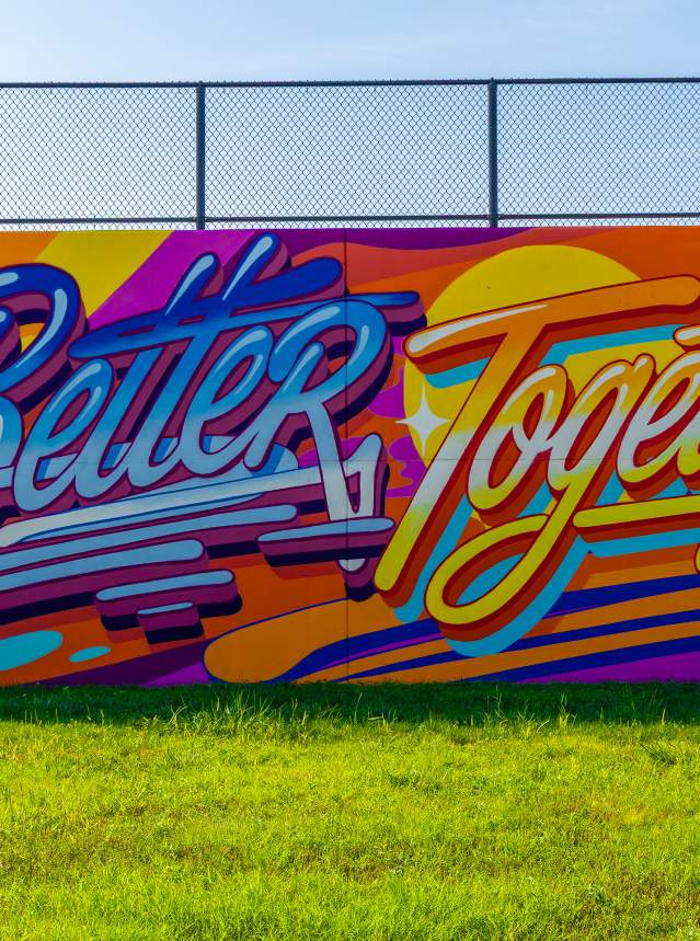 Mural titled We're Better Together by Queen Andrea for the BOOM! Salina festival in Salina, Kansas