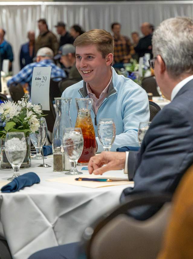 People at table with drinks at meeting event