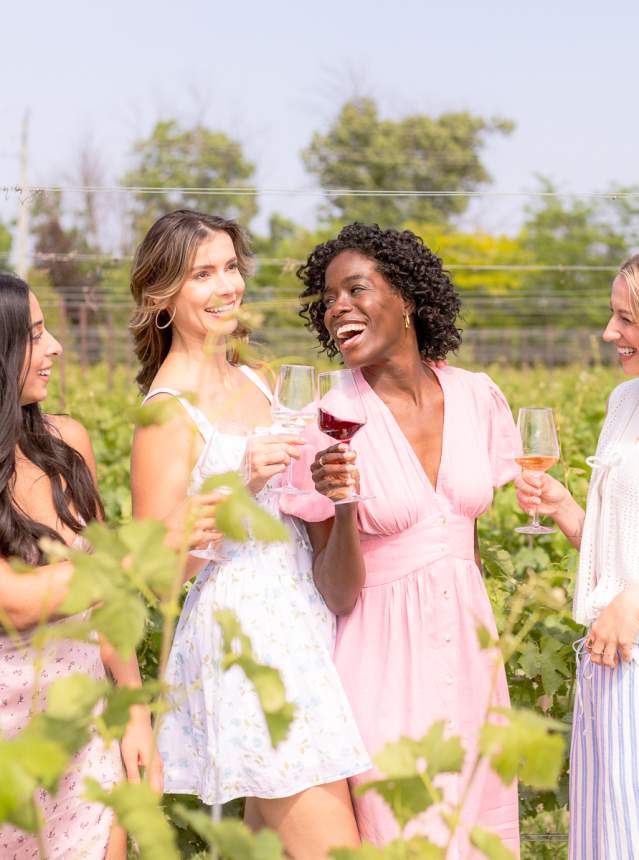 Girls laughing in a vineyard
