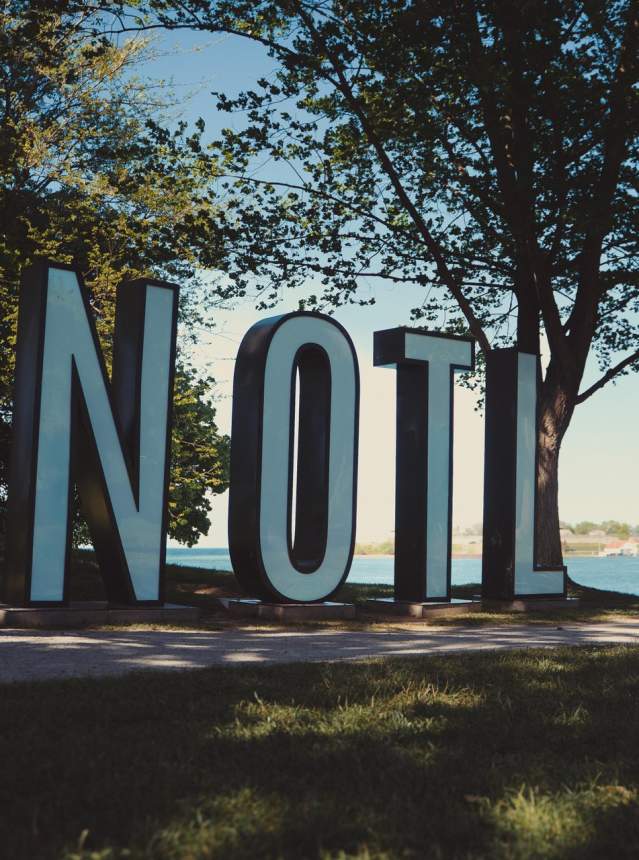 LED "NOTL" letters displayed in a waterfront park