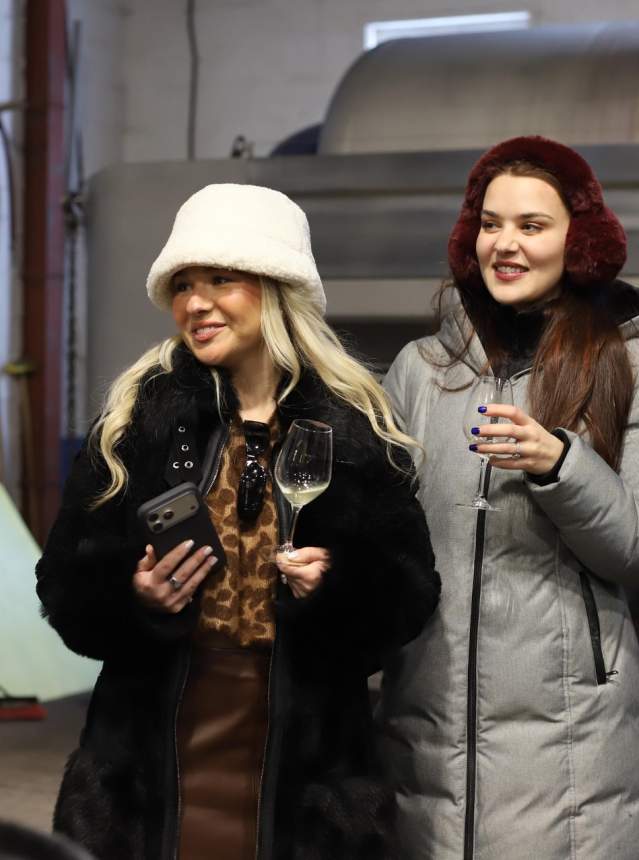 Ladies holding wine on a cellar tour