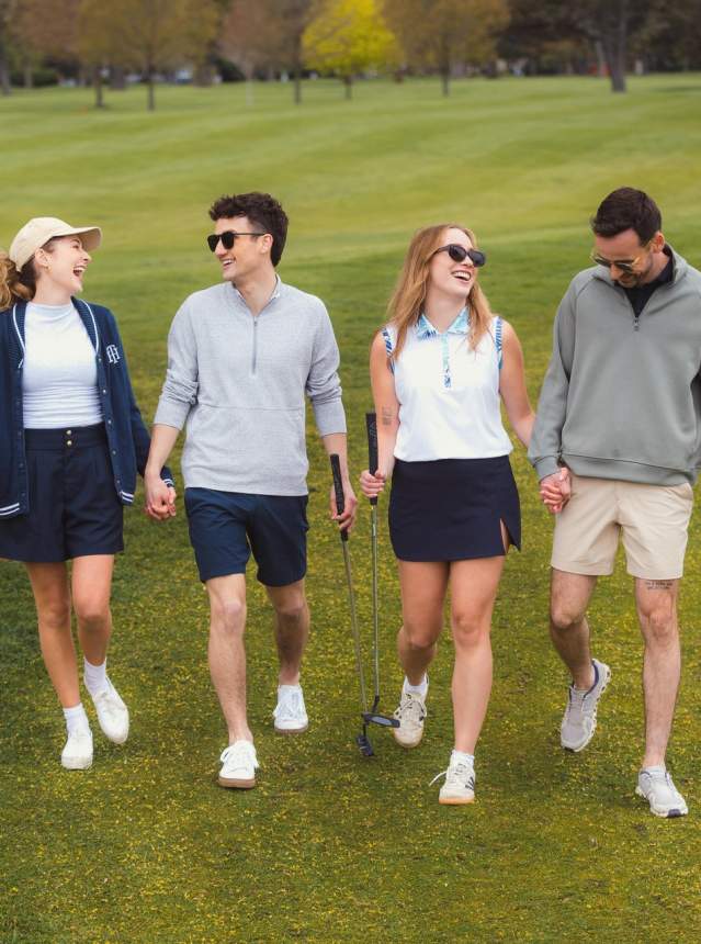 Golfers smiling on green