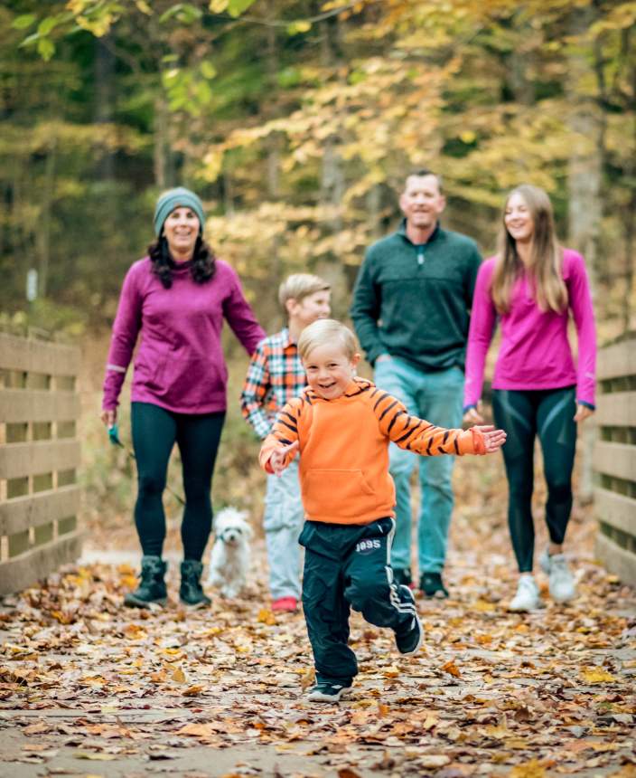 family on a trail in the fall