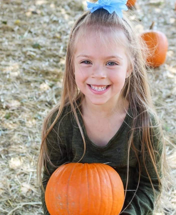 girl with pumpkin