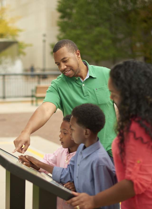 Family Looking at Map at Capital Mall