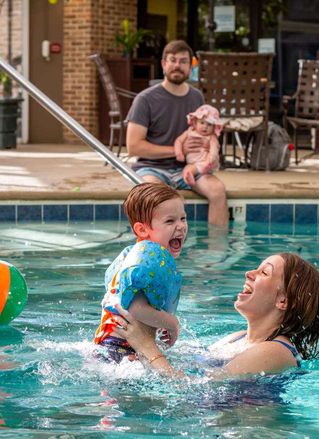 Mom and son playing in a pool