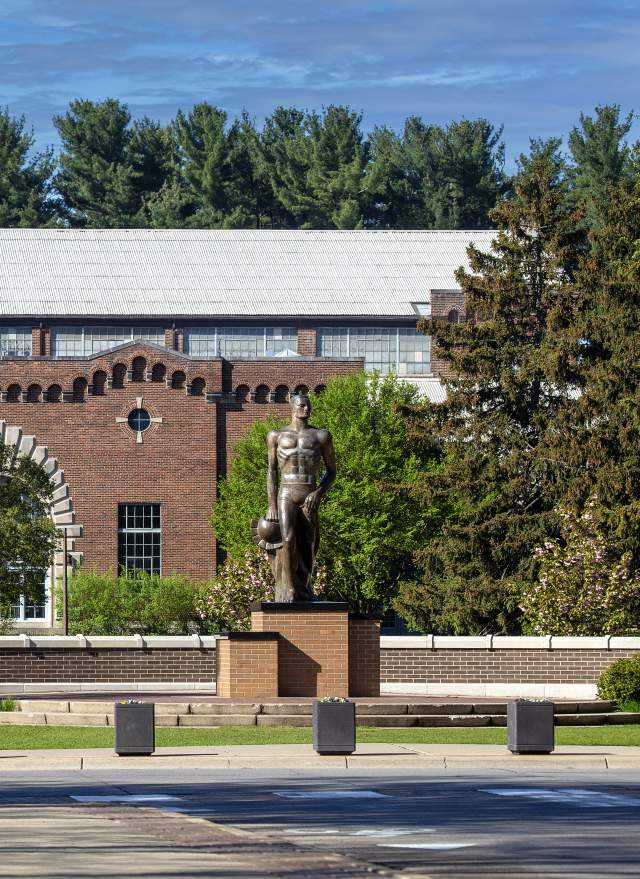 Sparty Statue at Michigan State University with Michigan State University flag