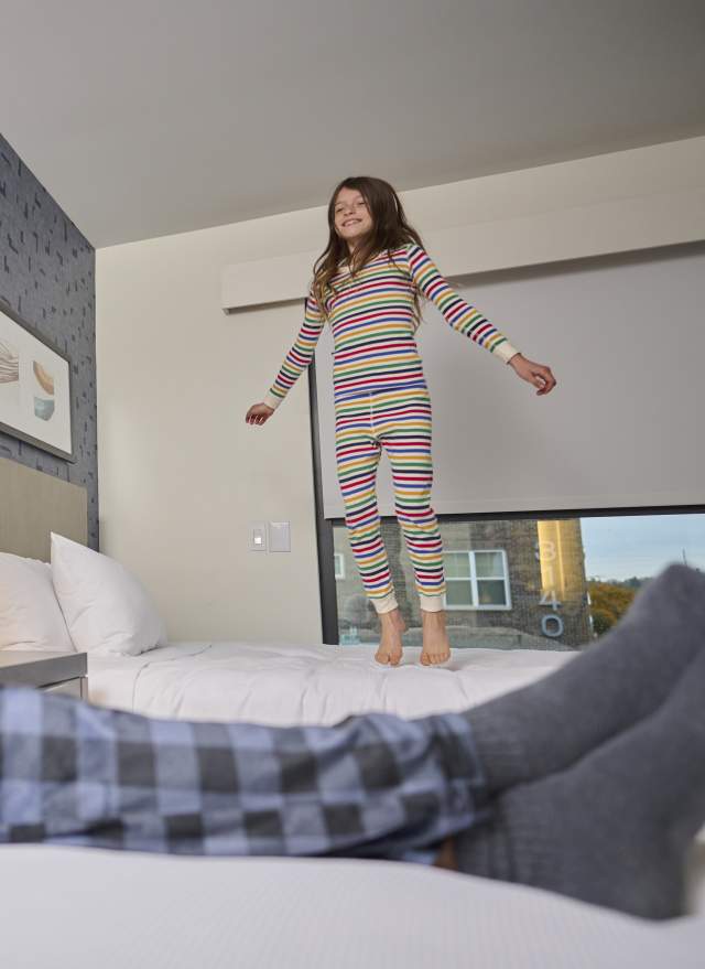 Kid jumping on the bed