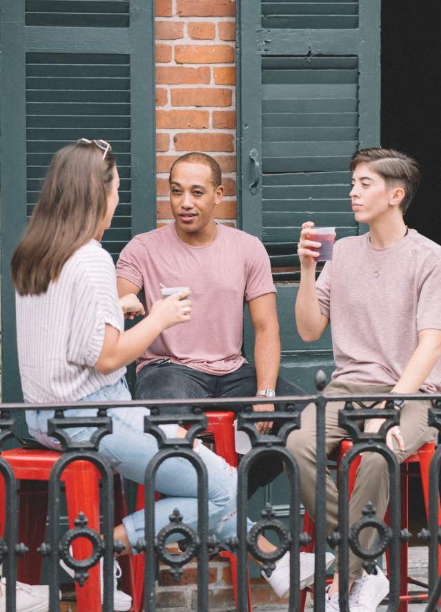 LGBTQ Friends Having Drinks on a French Quarter Balcony