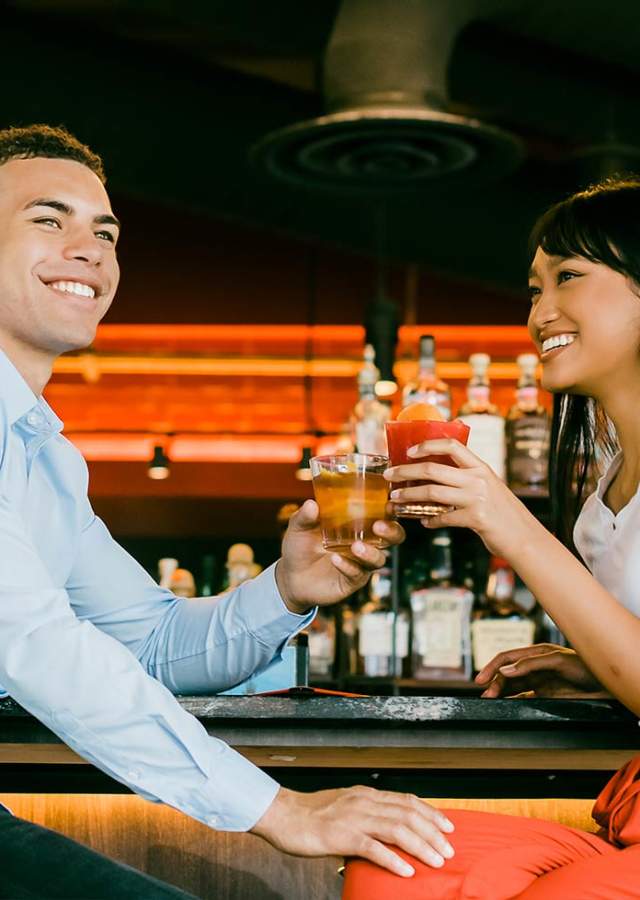 A couple having drinks at a bar