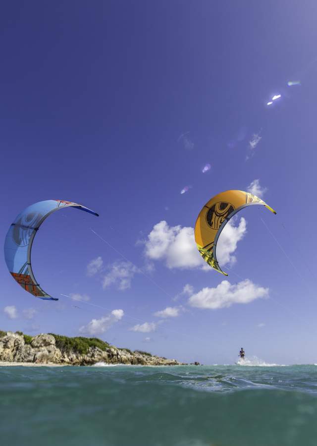 Two People Windsurfing