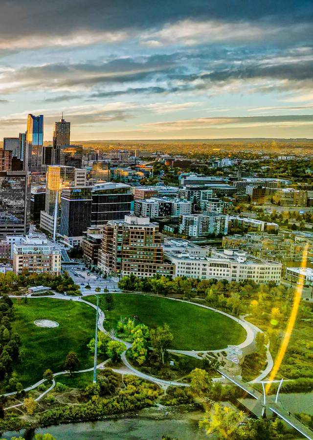 An aerial view of the Denver, Colorado, skyline during sunrise.