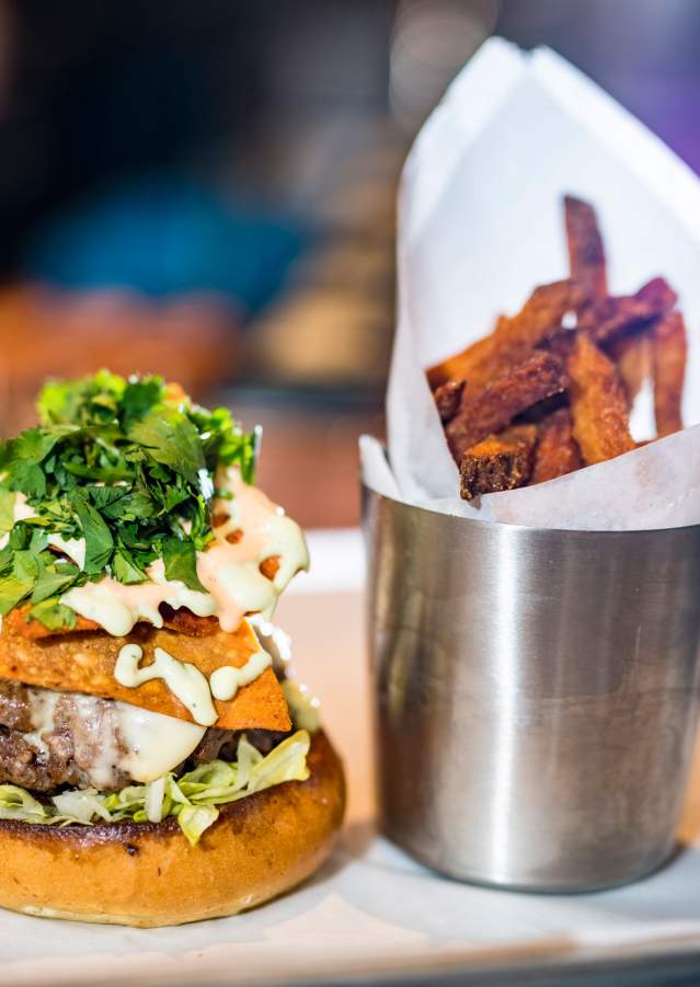 A Cheeseburger with a side of sweet potato fries from Farmer & the Cow.