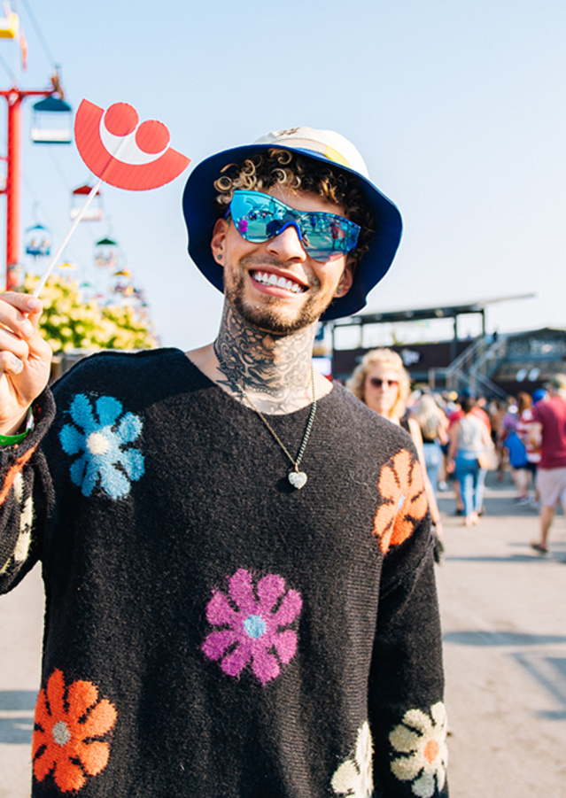 man smiling in a flower setting