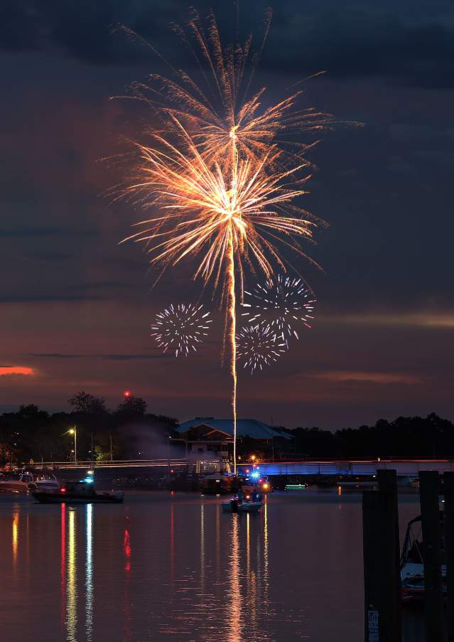 Madisonville 4th of July fireworks at sunset over the Tchefuncte River_photo by Joanie Johnston