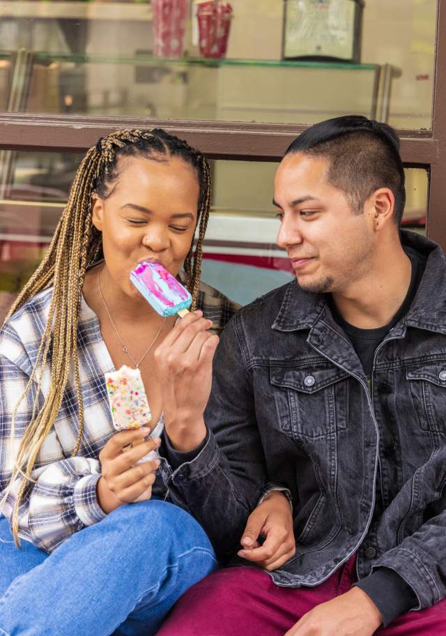Photo of couple eating ice cream.