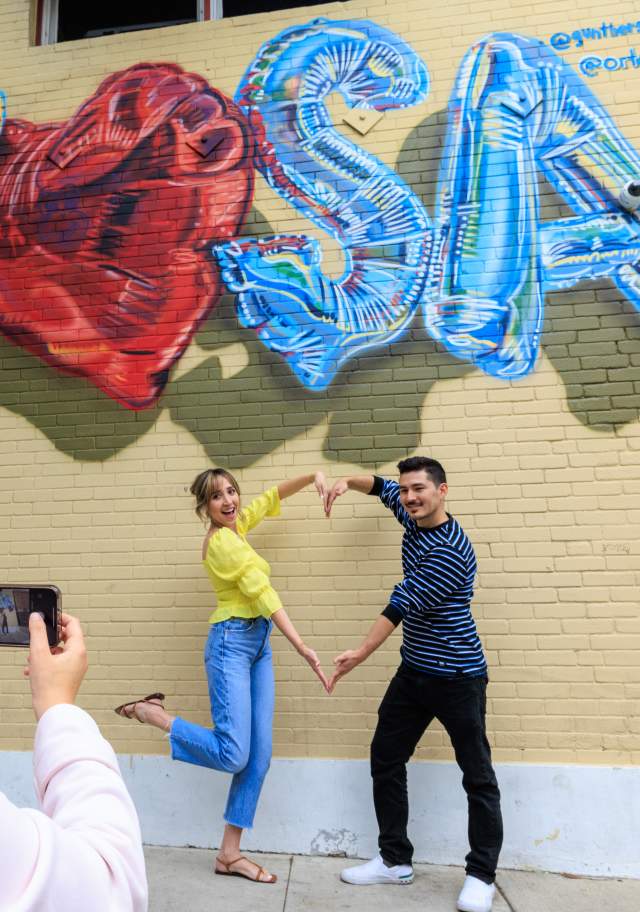 Couple in front of I HEART mural
