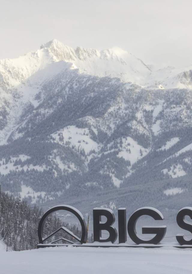 Big Sky sign with snowy mountain backdrop