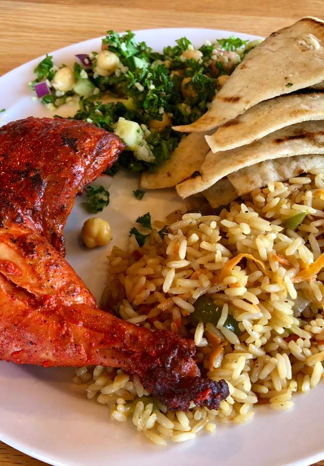 platter of chicken and sides with an international flair
