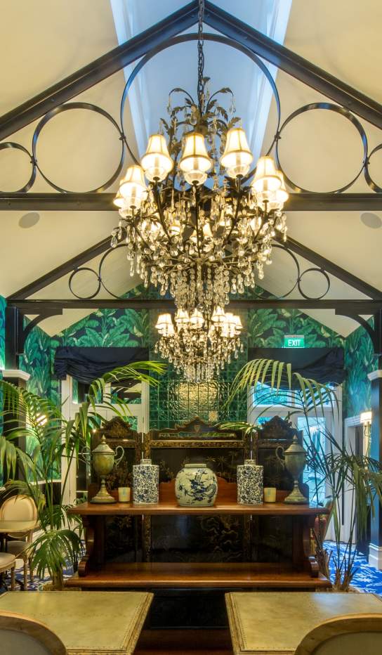 Hulbert House lounge with palm tree decor