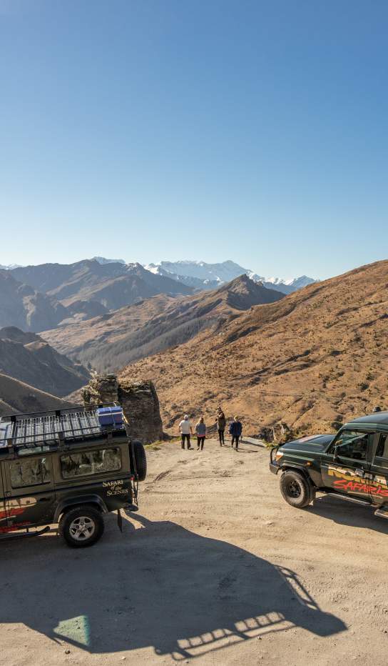 Group with two cars parked at Lighthouse Point on the Skippers Road Queenstown