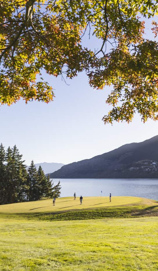 Golfers at Queenstown Golf course in spring