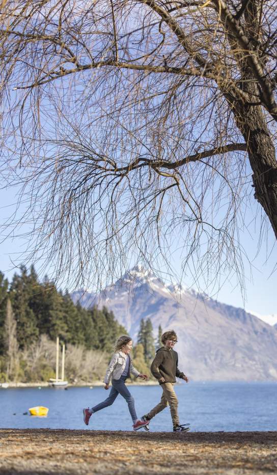 Family enjoying themselves on Queenstown Beach in spring