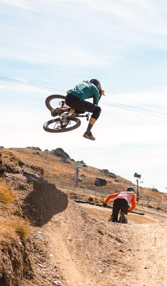 Mountain Biking does a jump at Cardrona Bike Park