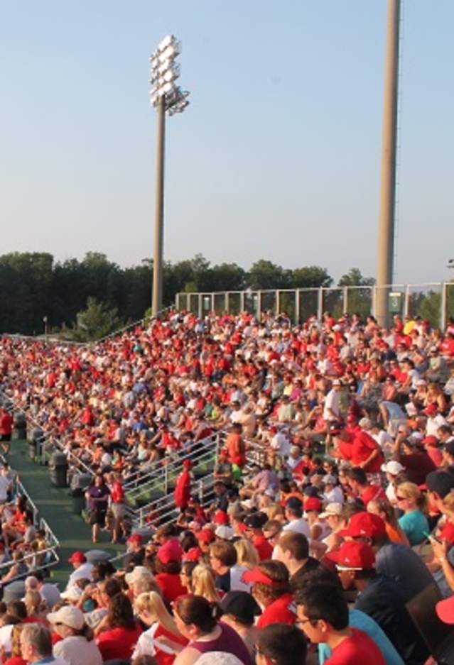 crowds of people in the stands at a baseball game
