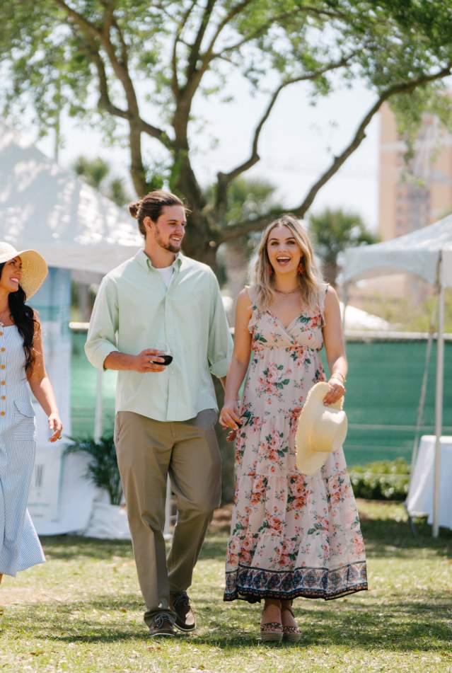 Guests strolling through the UNwineD garden party in Panama City Beach