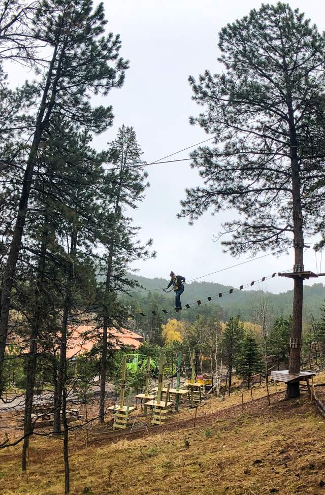 person on the obstacle course at rushmore tramway in keystone, sd