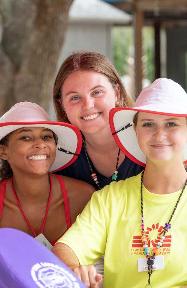Three members of Parks staff smiling