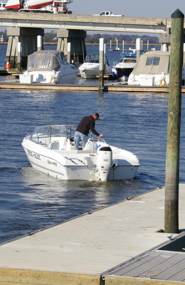 Boat on water near landing dock